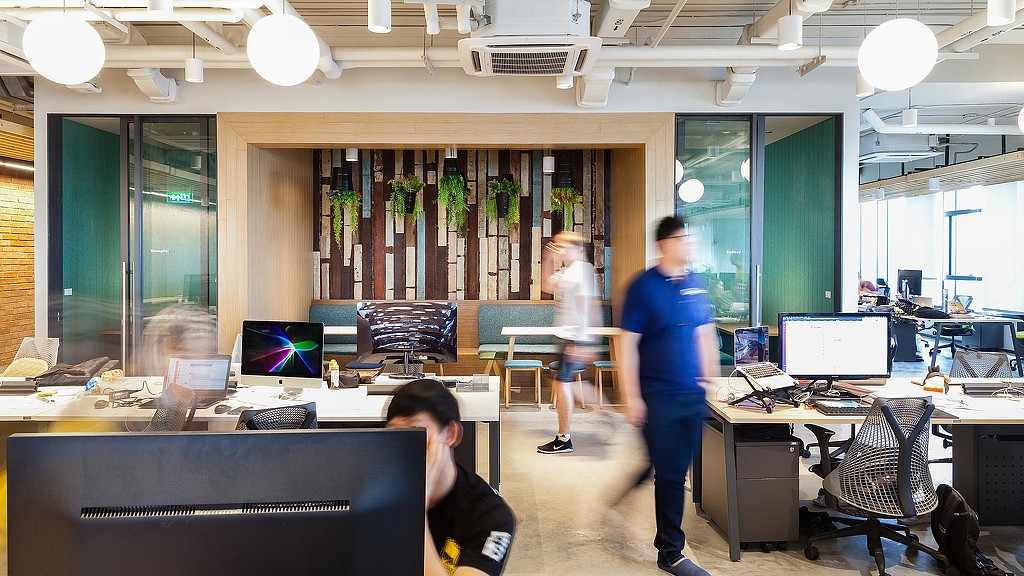 A group of people in an office.